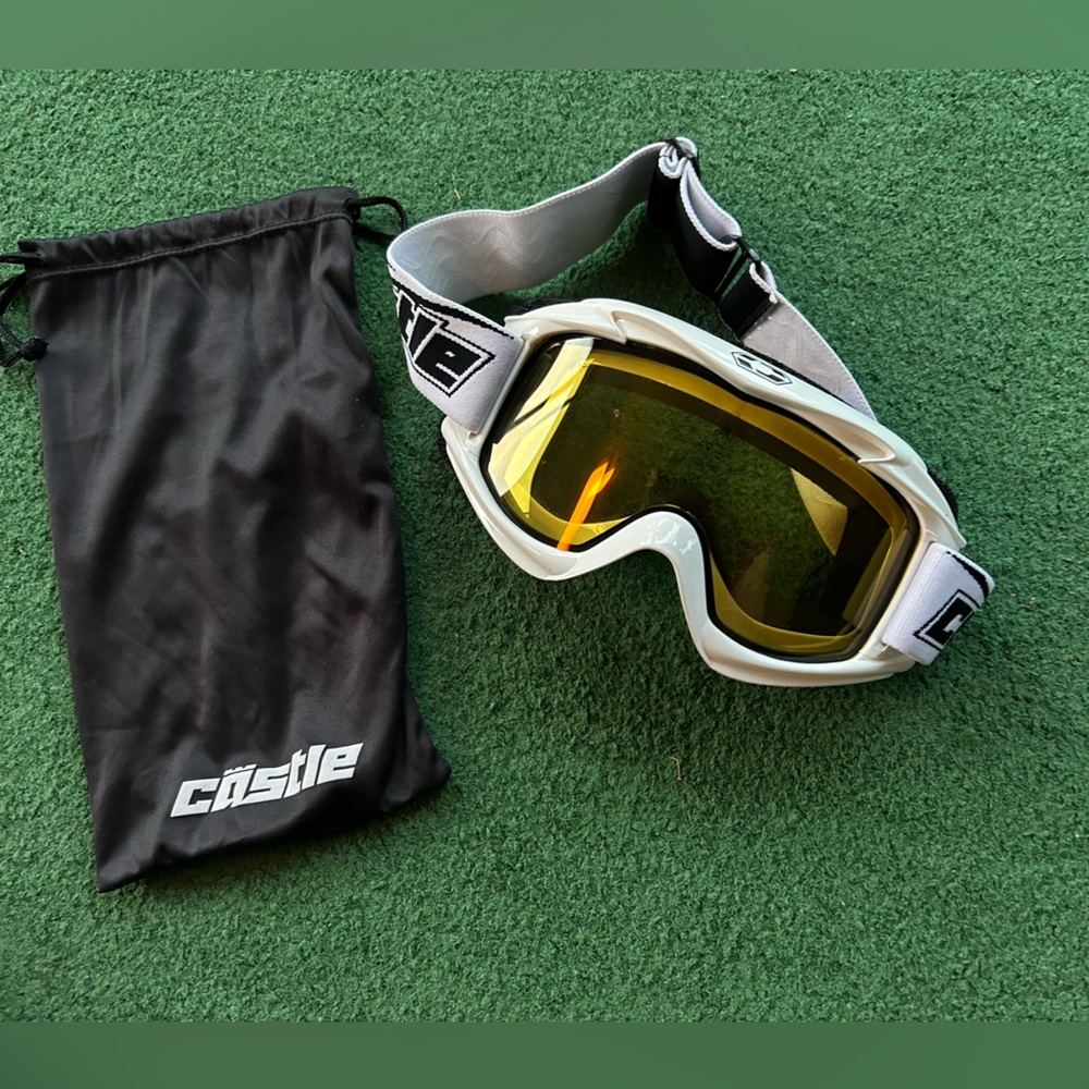 Snow goggles.  Castle brand with adjustable strap and drawstring carrying case.